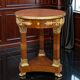 Circular gueridon empire of the 19th century in marquetry ornamented with gilt bronze