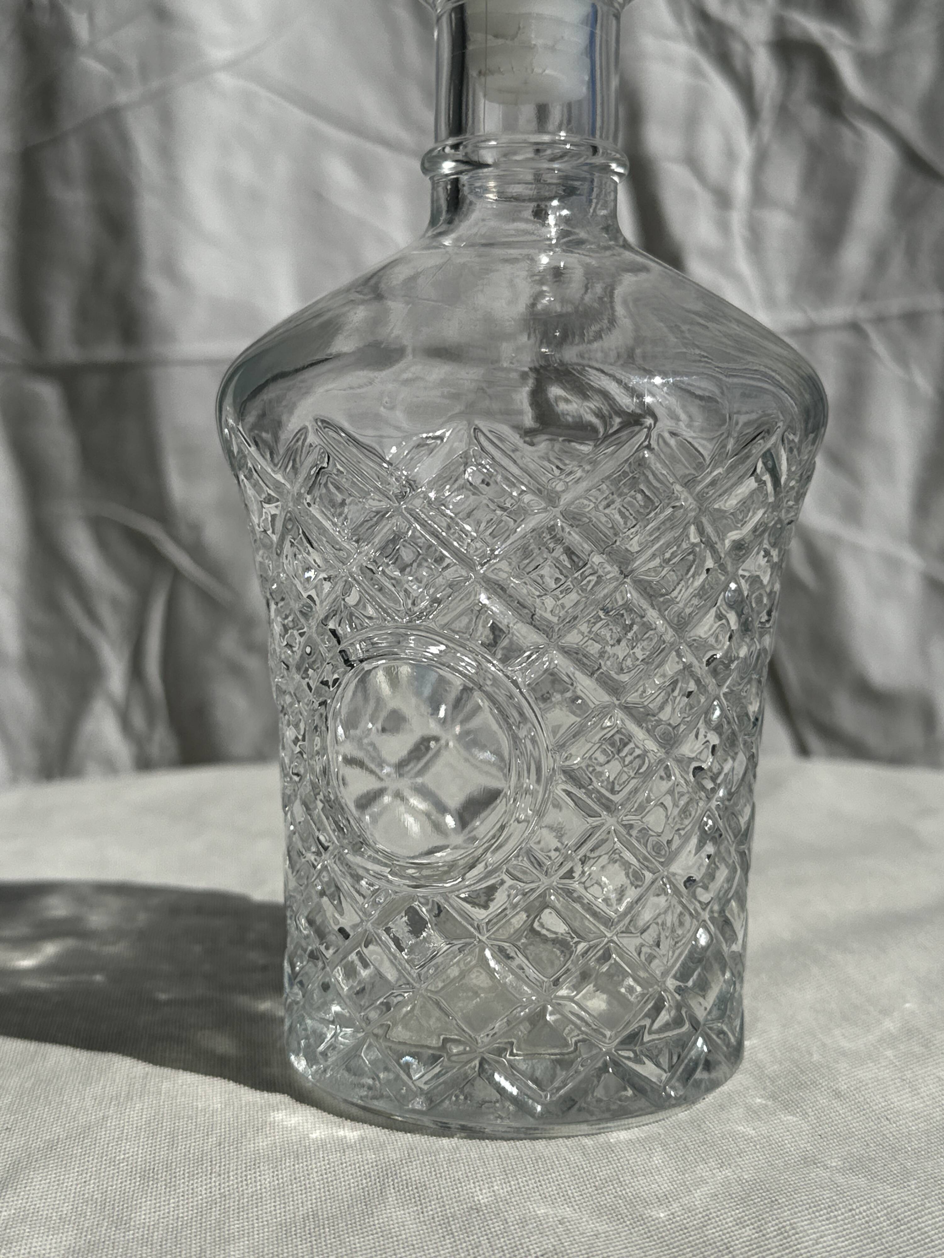Small cylindrical glass whiskey decanter H:23