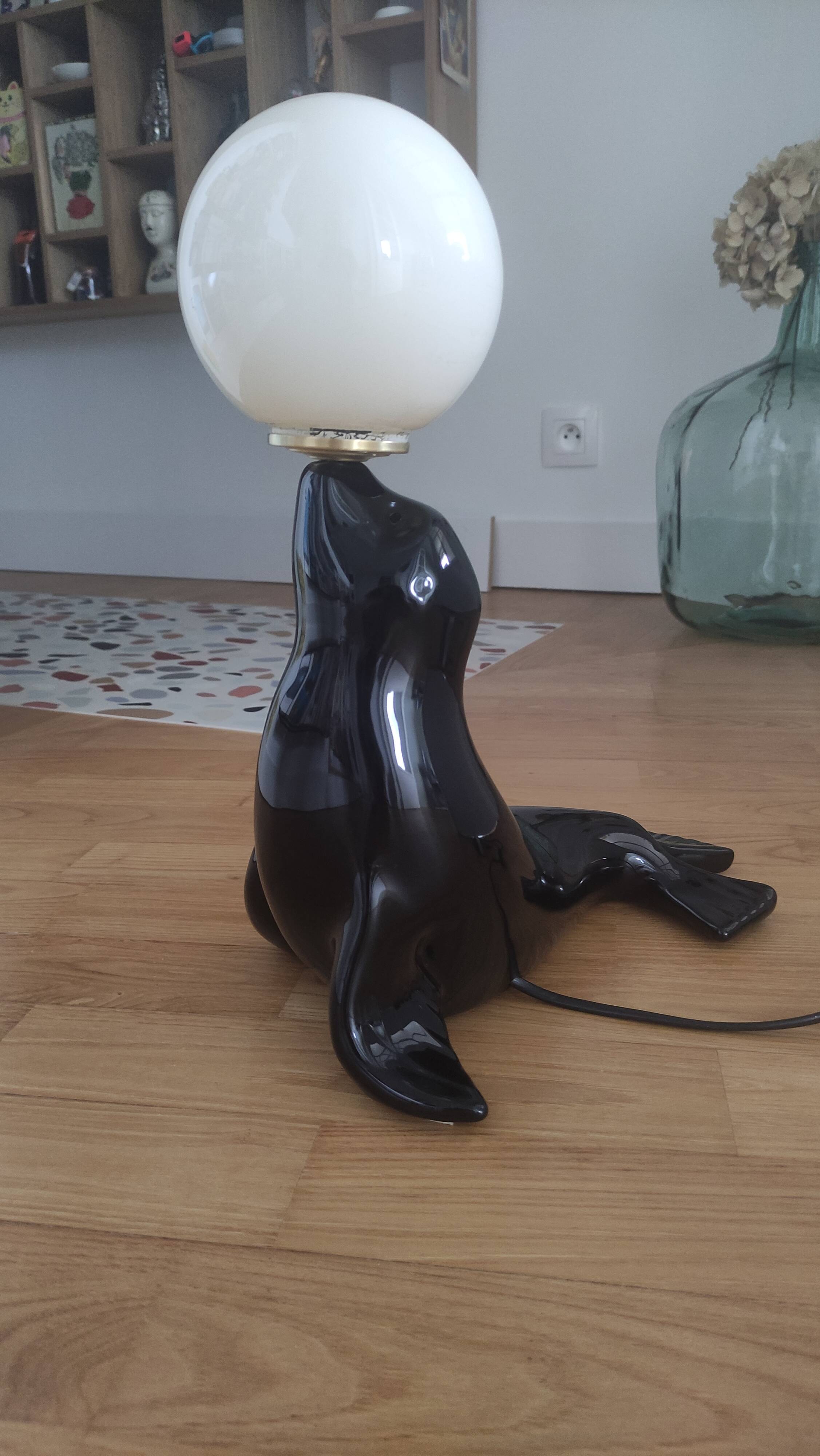 Vintage black sea lion lamp
