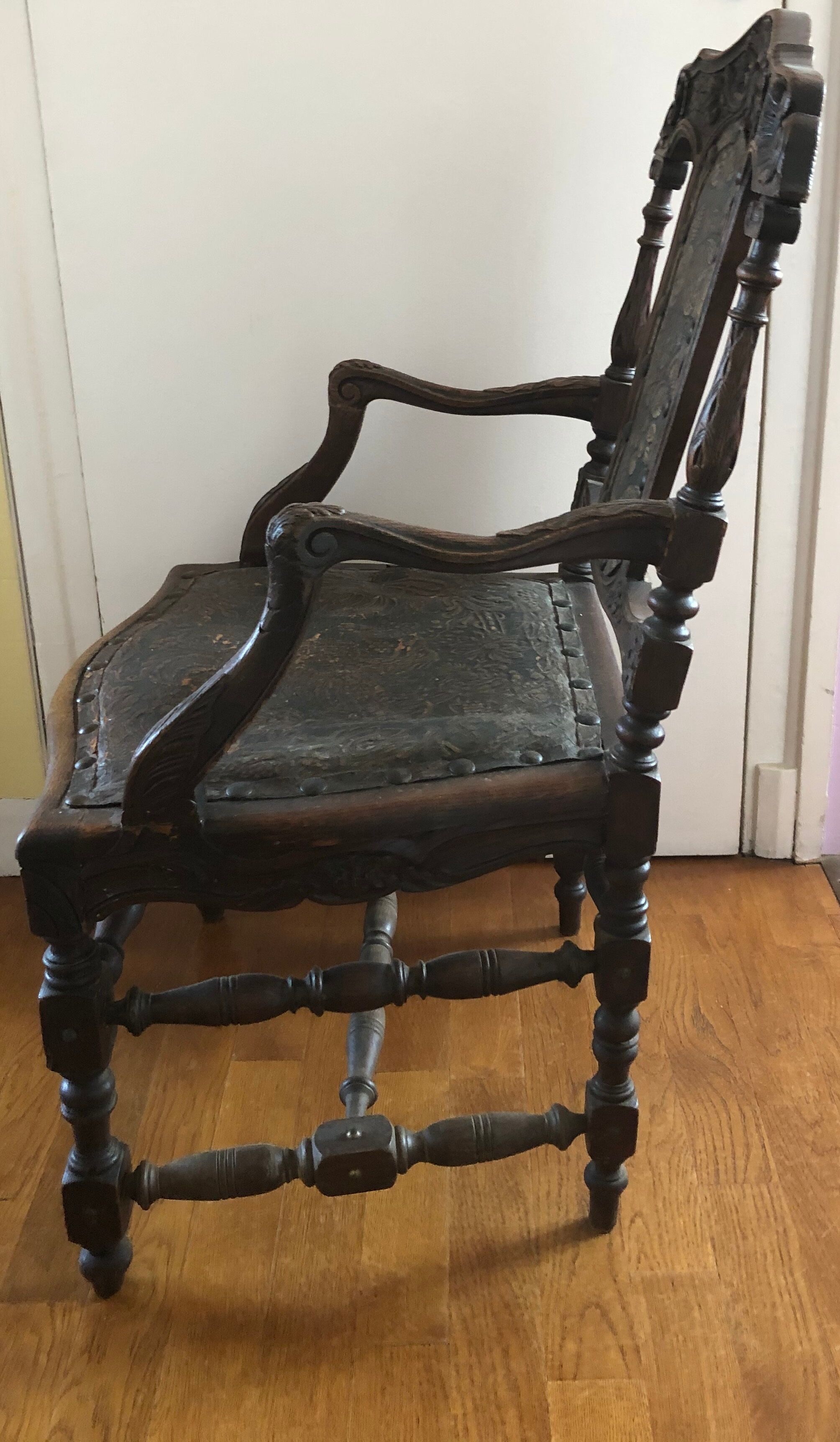 Old carved wooden armchair