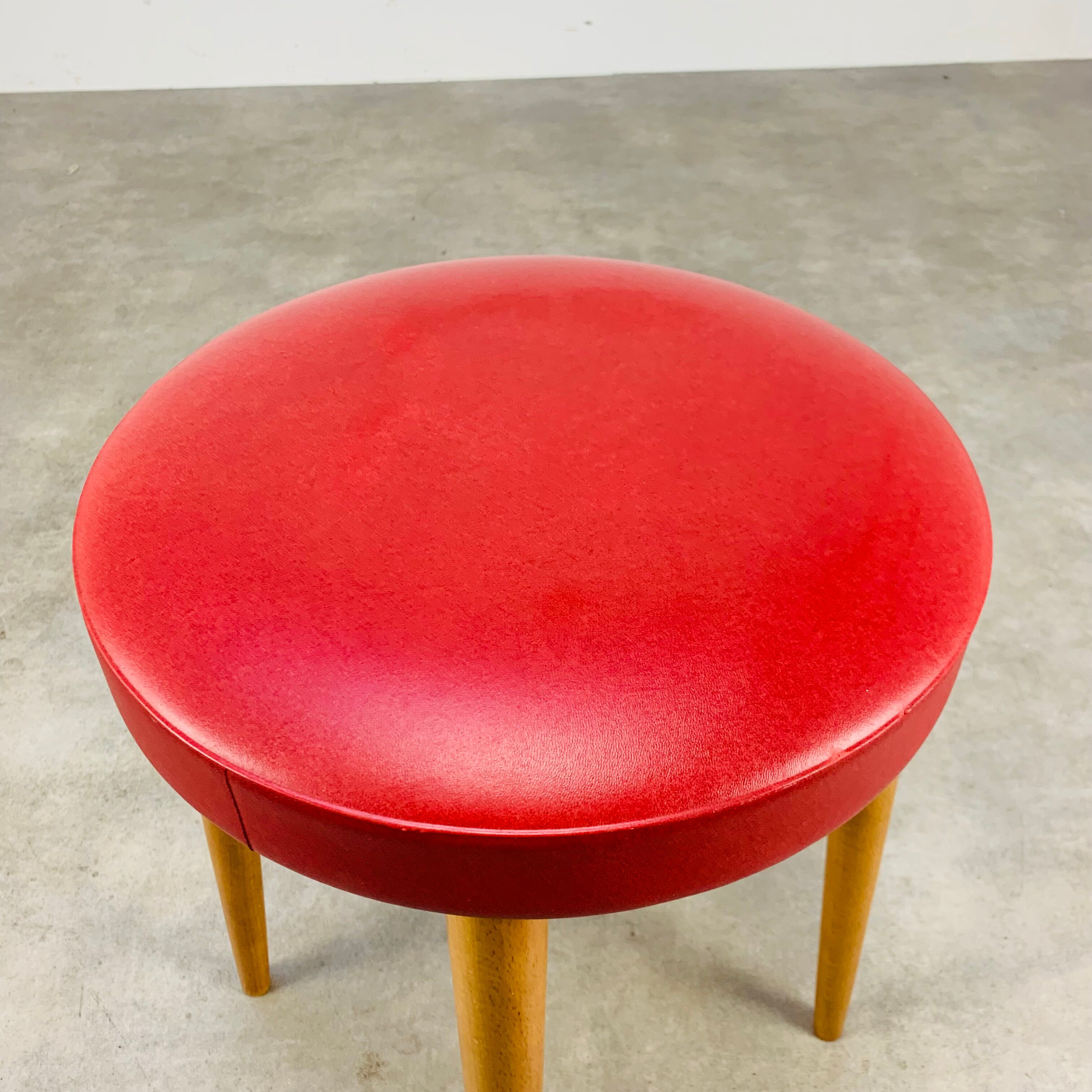 Baumann bistro stool wood and imitation red leather 60s