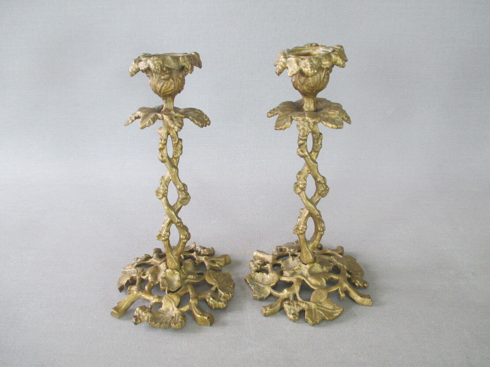 Pair of gilded bronze candlesticks with vine décor