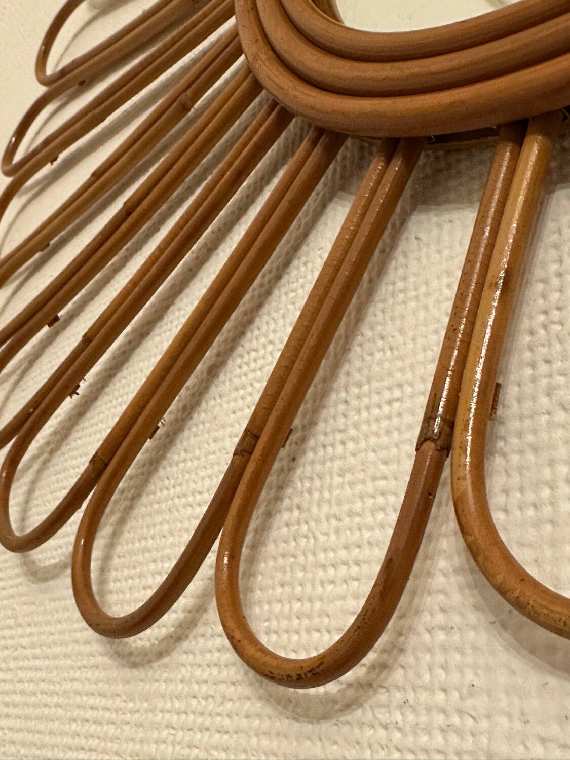 Old vintage asymmetrical round rattan mirror