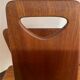 Magazine rack, in oak, by Pierre Cruège