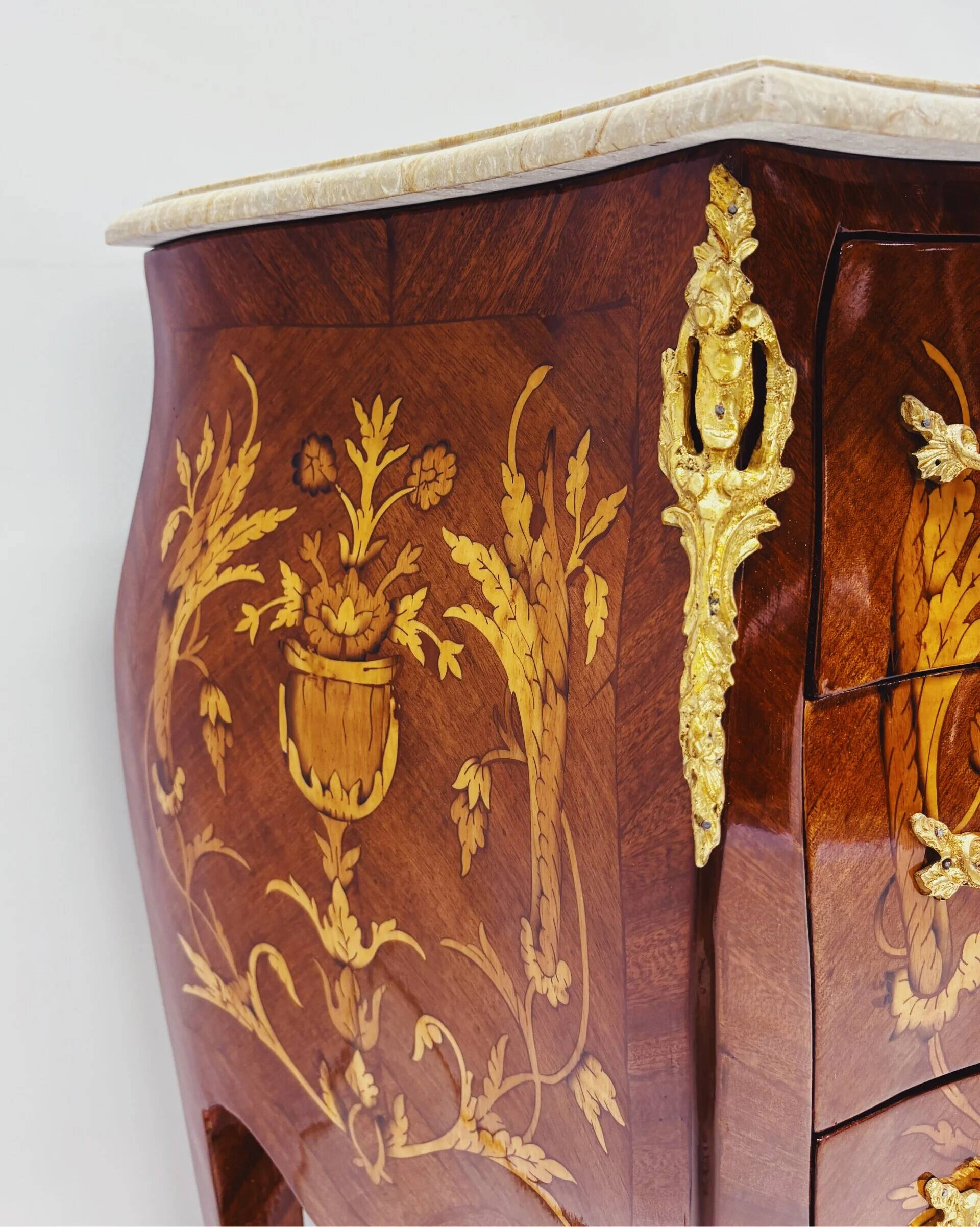 Marquetry chest of drawers with marble top in Louis XV style