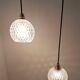 Two-light pendant in a cascade of cut crystal globe