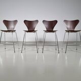 Set of 4 brown oak plywood bar stools by Fritz Hansen Series 7 by Arne Jacobsen.