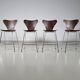 Set of 4 brown oak plywood bar stools by Fritz Hansen Series 7 by Arne Jacobsen.