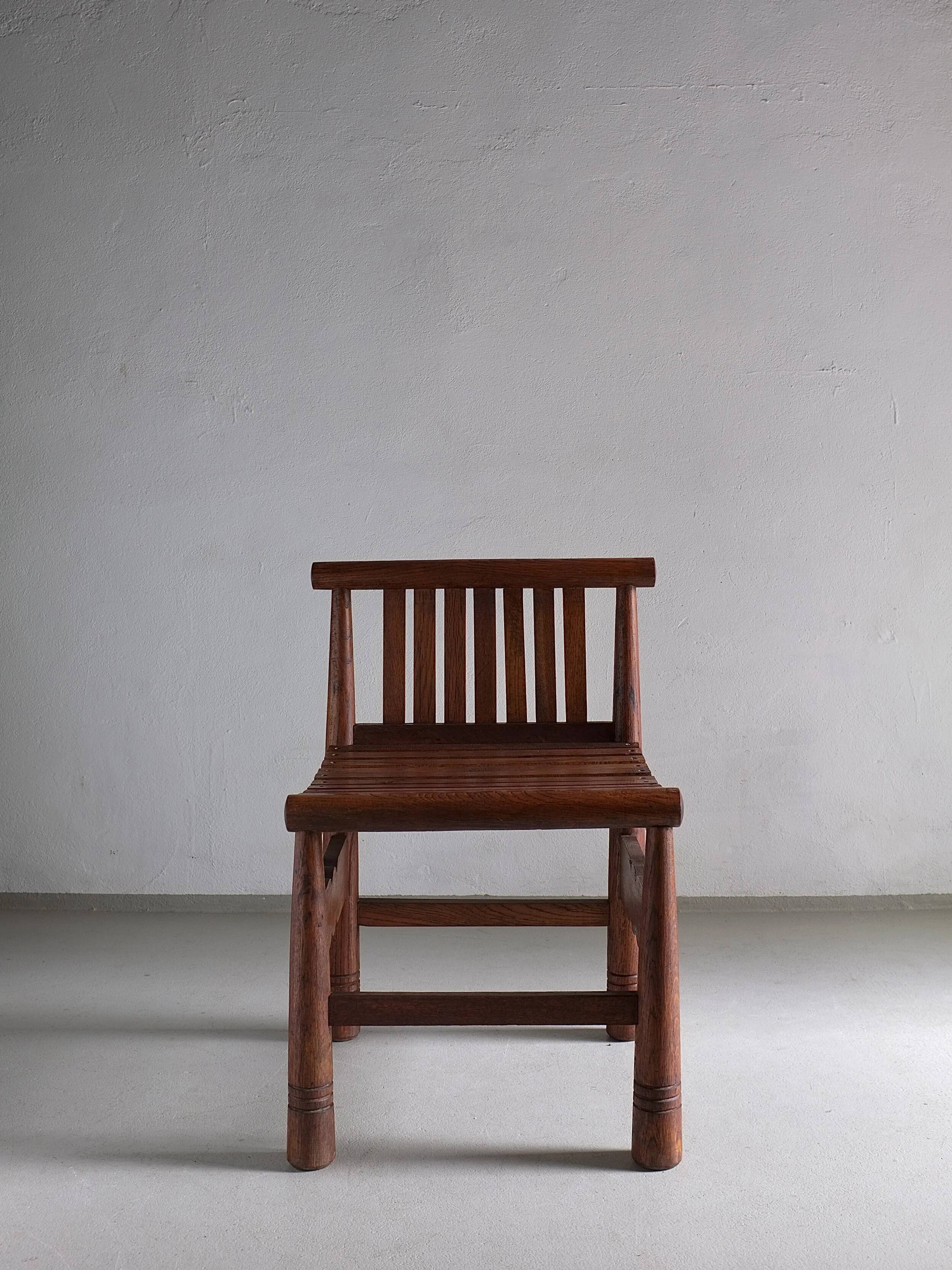 Carved oak low back chair | France | 1960s