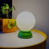 Vintage French table lamp with glass opaline shade and wooden green lamp base.