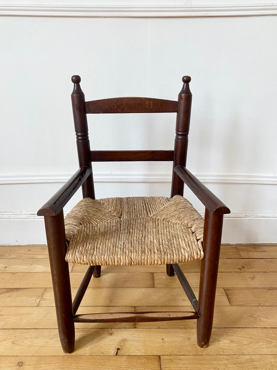 Wooden chair and children's straw