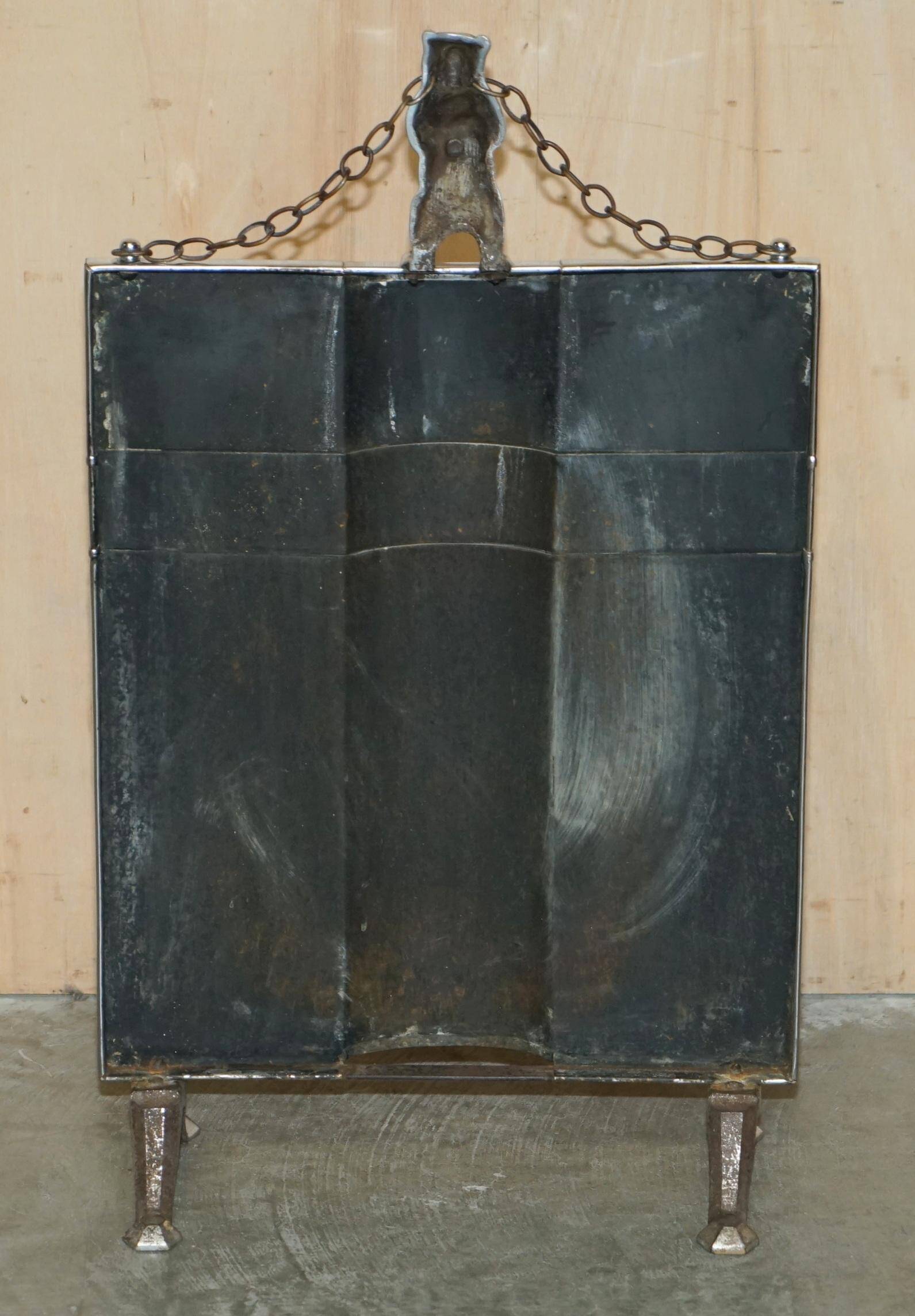 Art Deco fire screen from around 1920 in polished chrome with a bear.