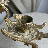 Bronze hand candlestick in the shape of a peacock