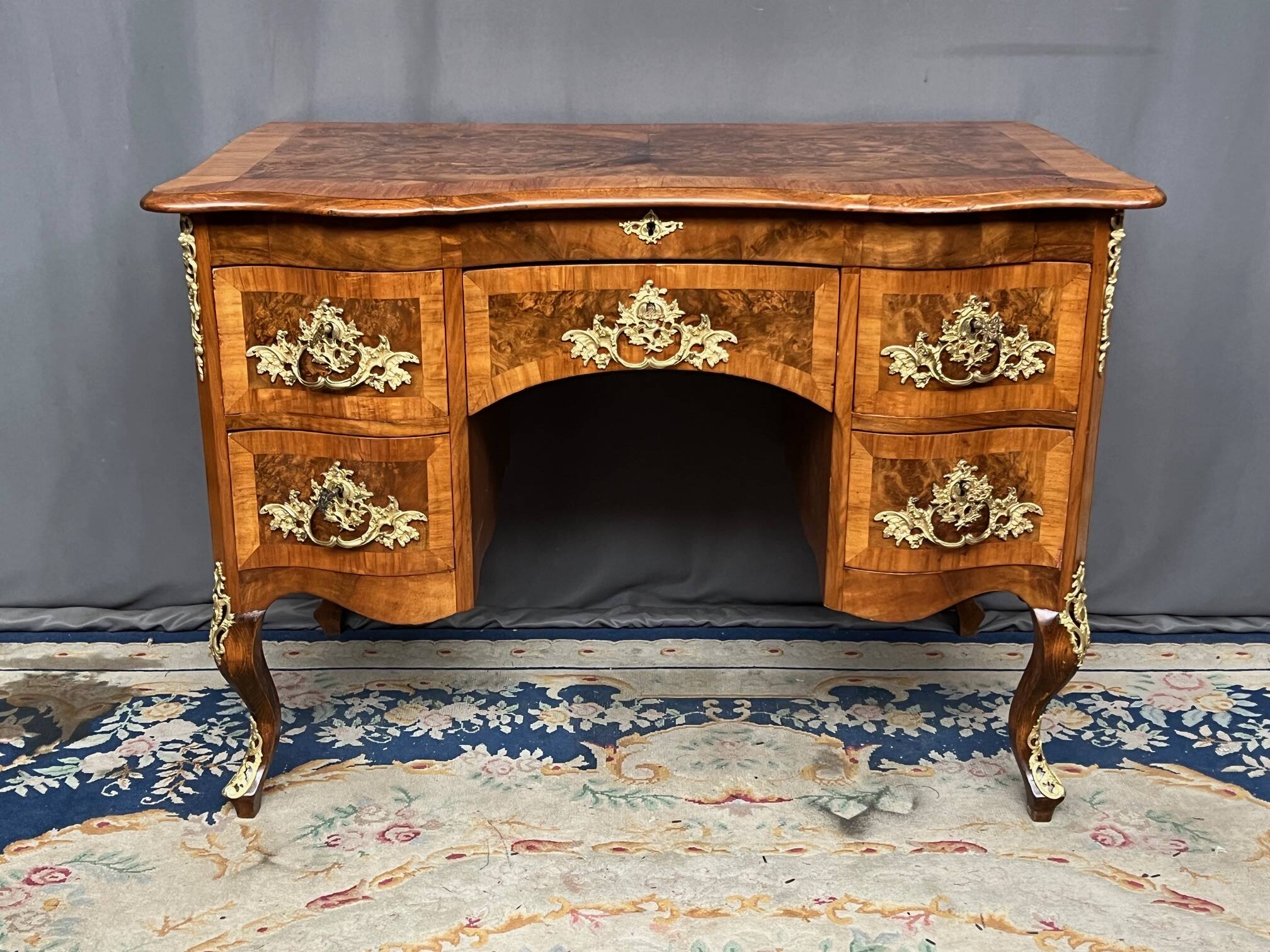 Antique baroque-style desk from Dresden with five drawers.