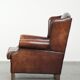 Vintage sheepskin wingback armchair with a timeless English look