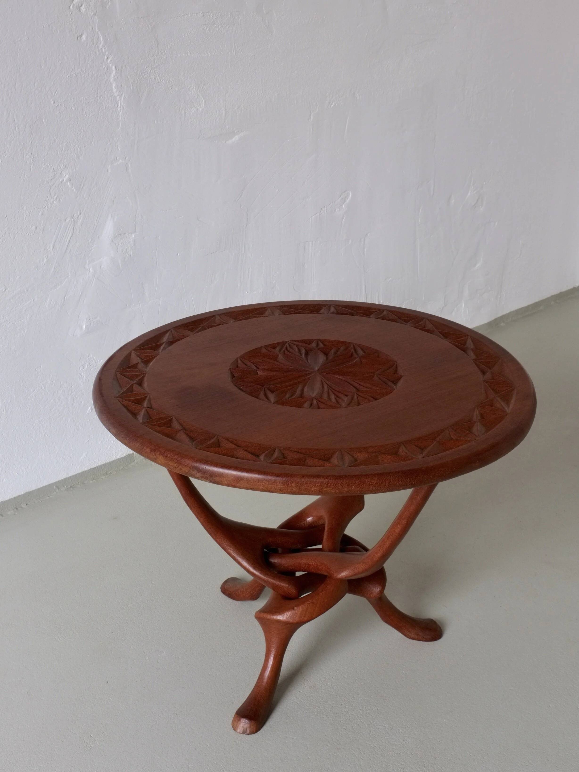 Sculptural carved teak side table | 1960s