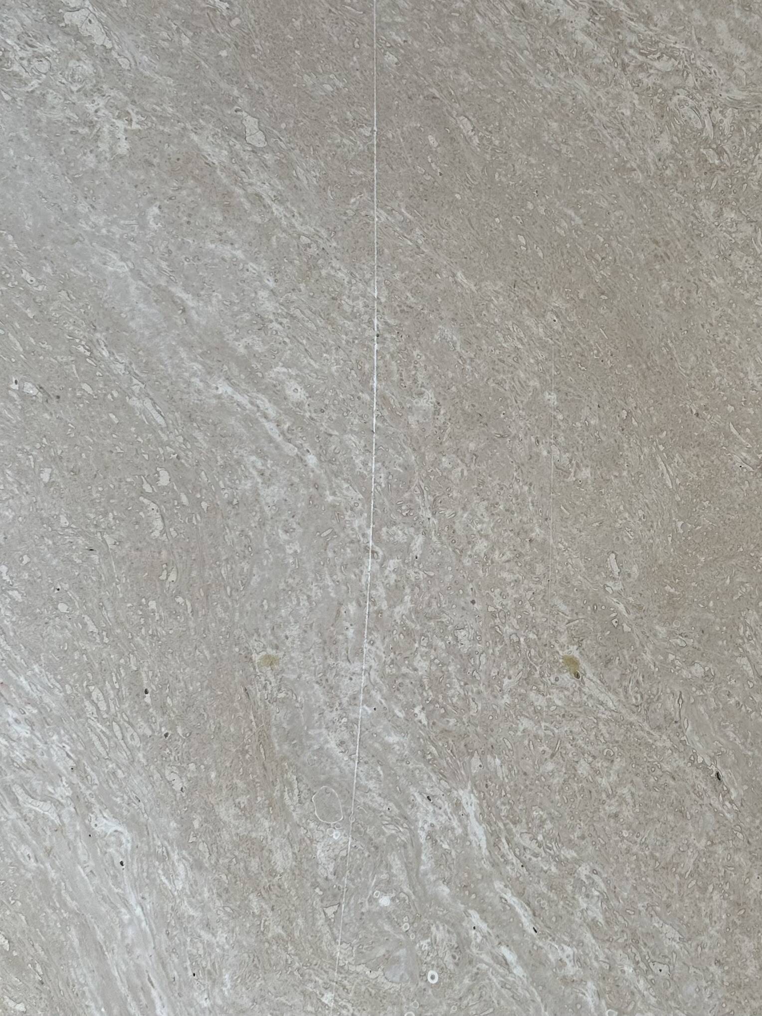 Travertine eye-shaped coffee table