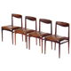 Set of four vintage mid century rosewood dining chairs with cognac leather seats