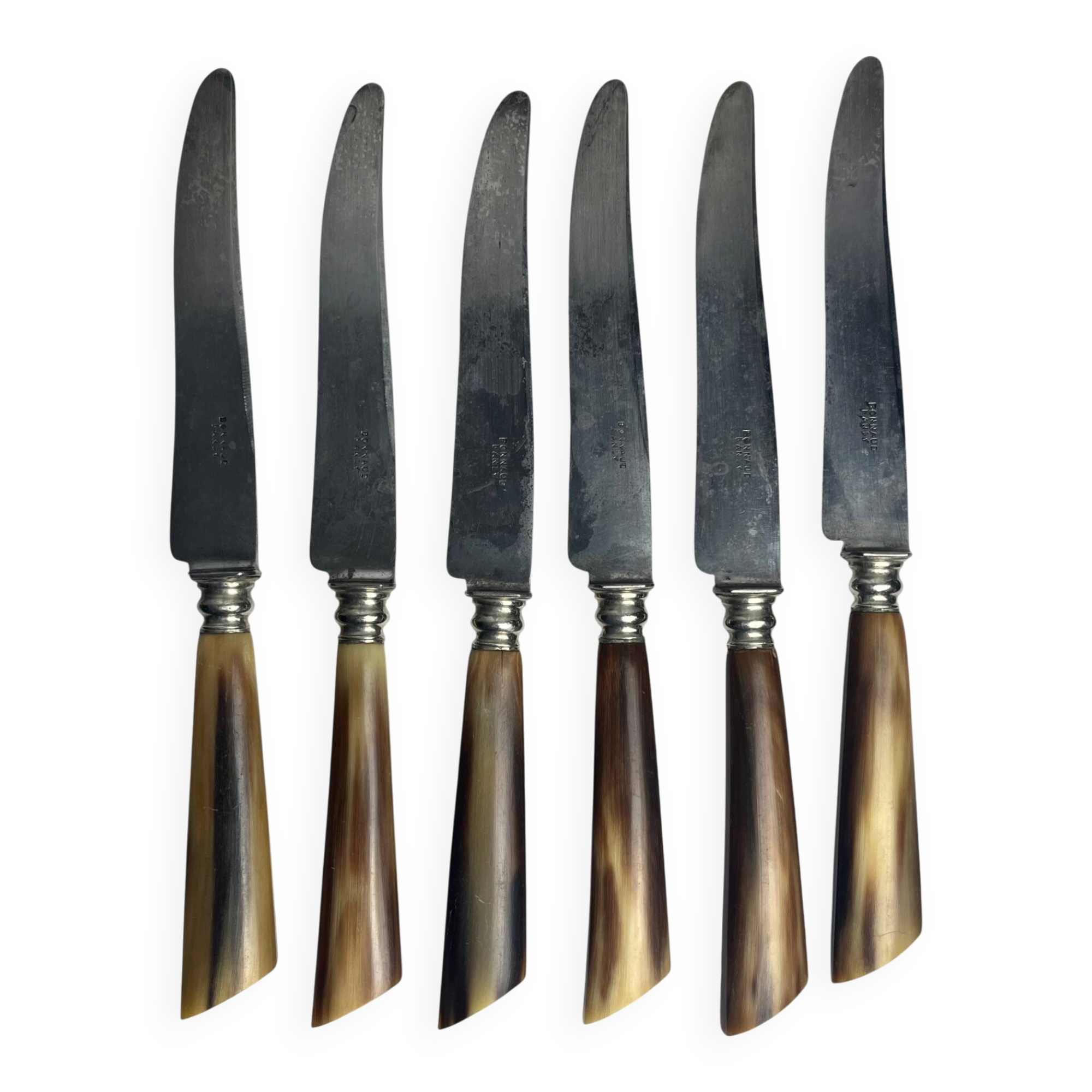 Six knives with steel blades and horn handles, Bonnaud Nancy, early 20th century.