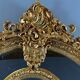 Large Louis XV style mirror in carved and gilded wood, 19th century