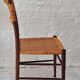 Four teak dining chairs with patinated cane after Gio Ponti, Italy 1960s