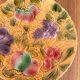 Round earthenware dish decorated with fruit in Sarreguemines slipware