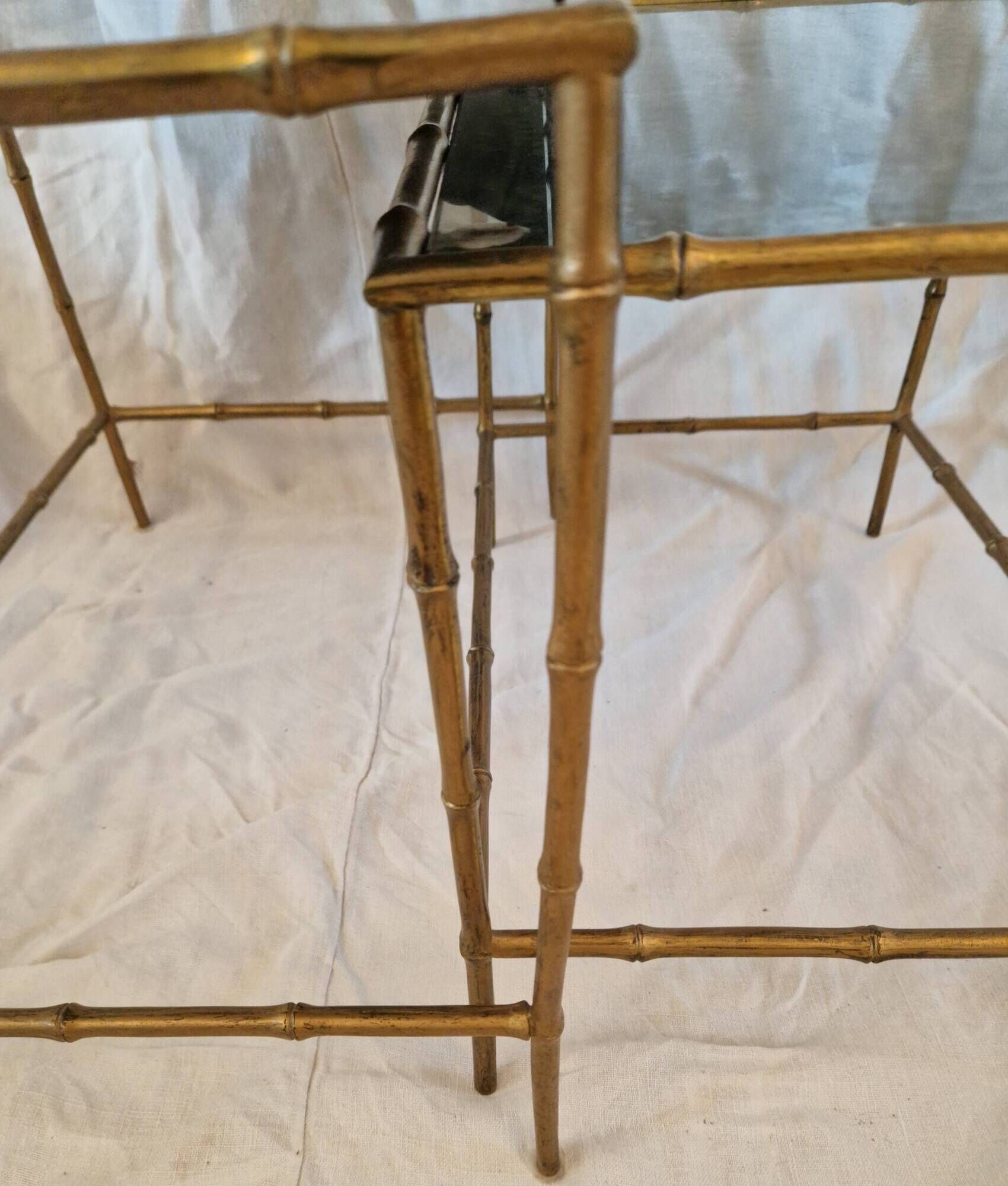 Pair of vintage nesting tables in faux bamboo with a gold finish – distressed mirrors