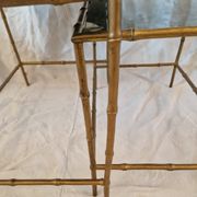Pair of vintage nesting tables in faux bamboo with a gold finish – distressed mirrors