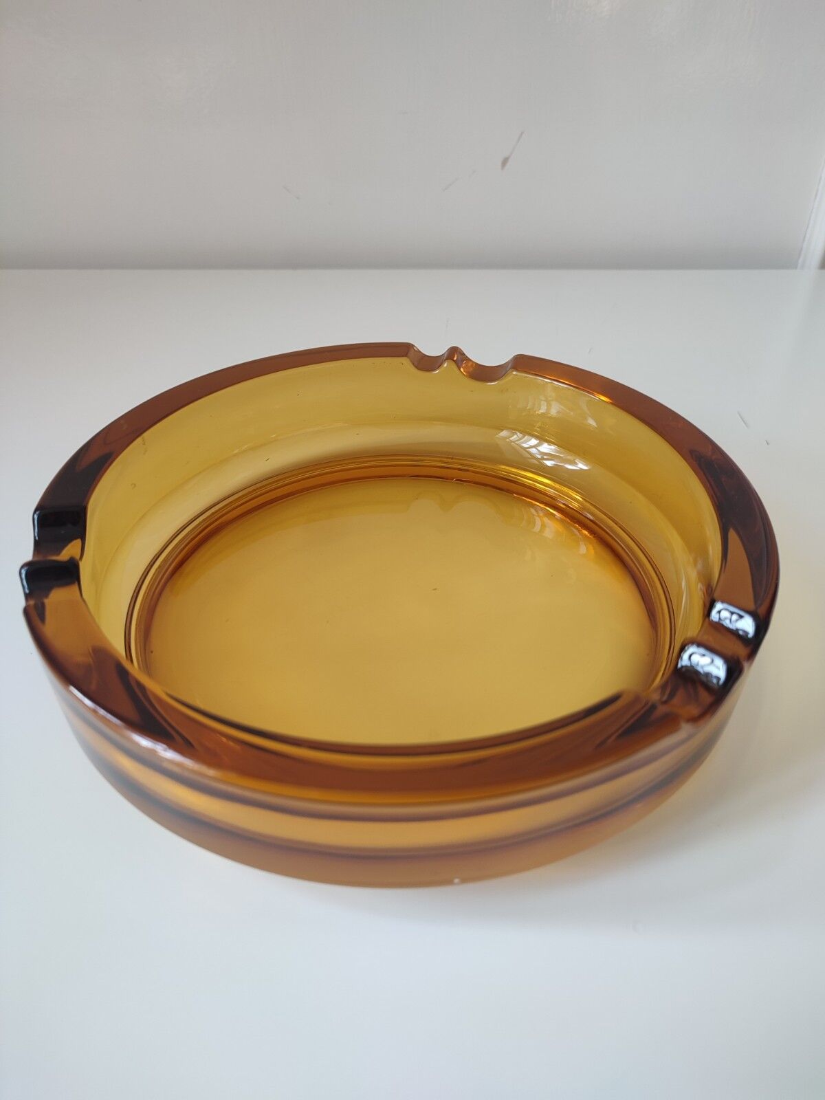Amber glass ashtray