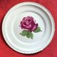 Decorative plate Harker with a red rose in the centre and a 22-carat gold border.