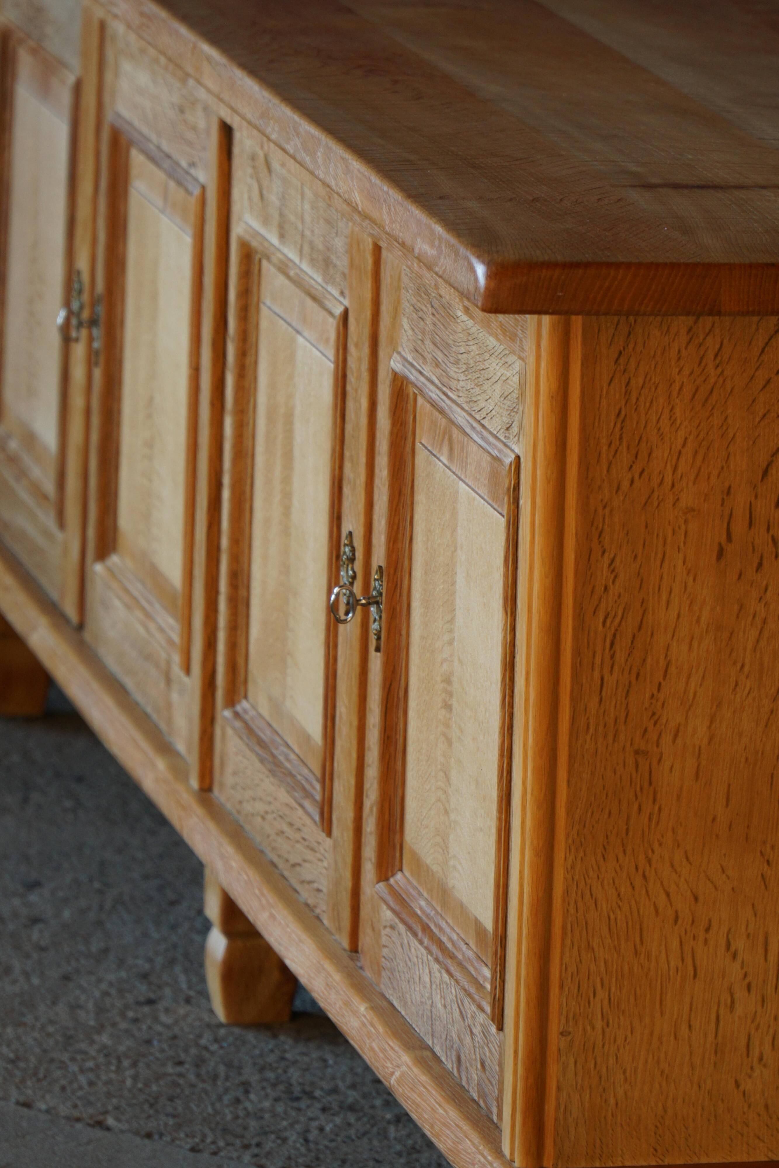 Modern Danish low enfilade in oak with panelled doors, mid-20th century.