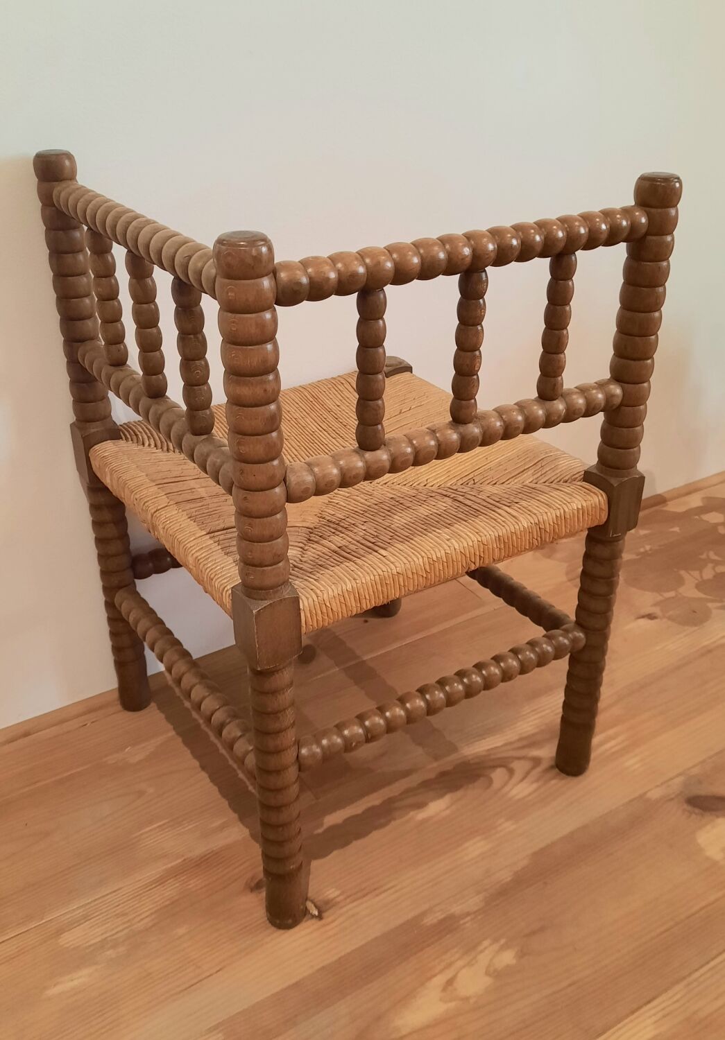Turned wooden corner chair