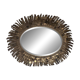 Large oval sun mirror in patinated gold metal.
