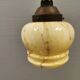 Small Art Deco hanging lamp in cream colored glass with bakelite top. Estimated 1950s