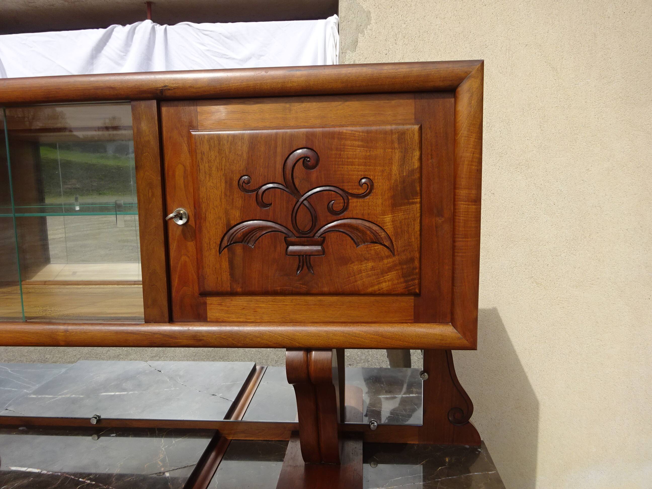 Solid walnut sideboard, moustache legs, black marble top.