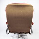Armchair upholstered with red leather and frame of metal, of danish design from the 1960s