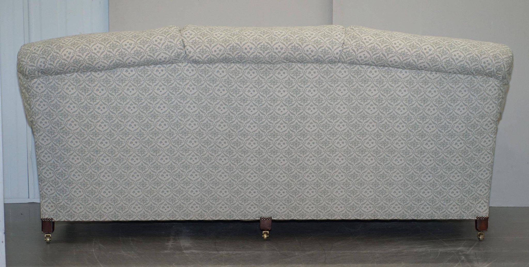 Howard & Sons canapé with feather cushions and ticking fabric, Victorian style.
