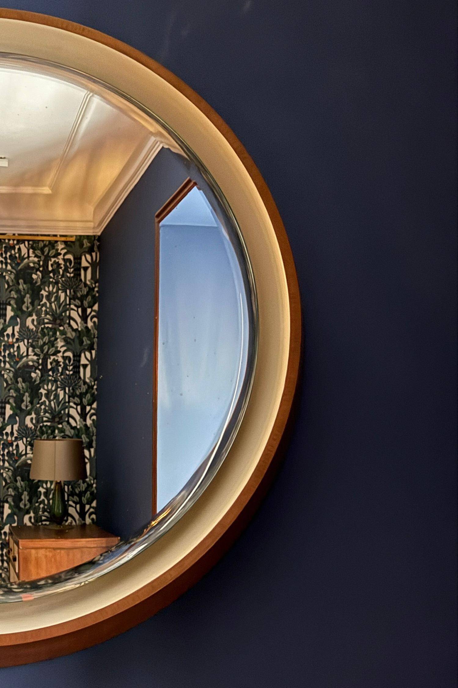 Backlit mirror designed by Gio Ponti in wood and lacquer. Italy, 1970s.