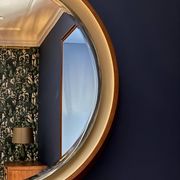 Backlit mirror designed by Gio Ponti in wood and lacquer. Italy, 1970s.