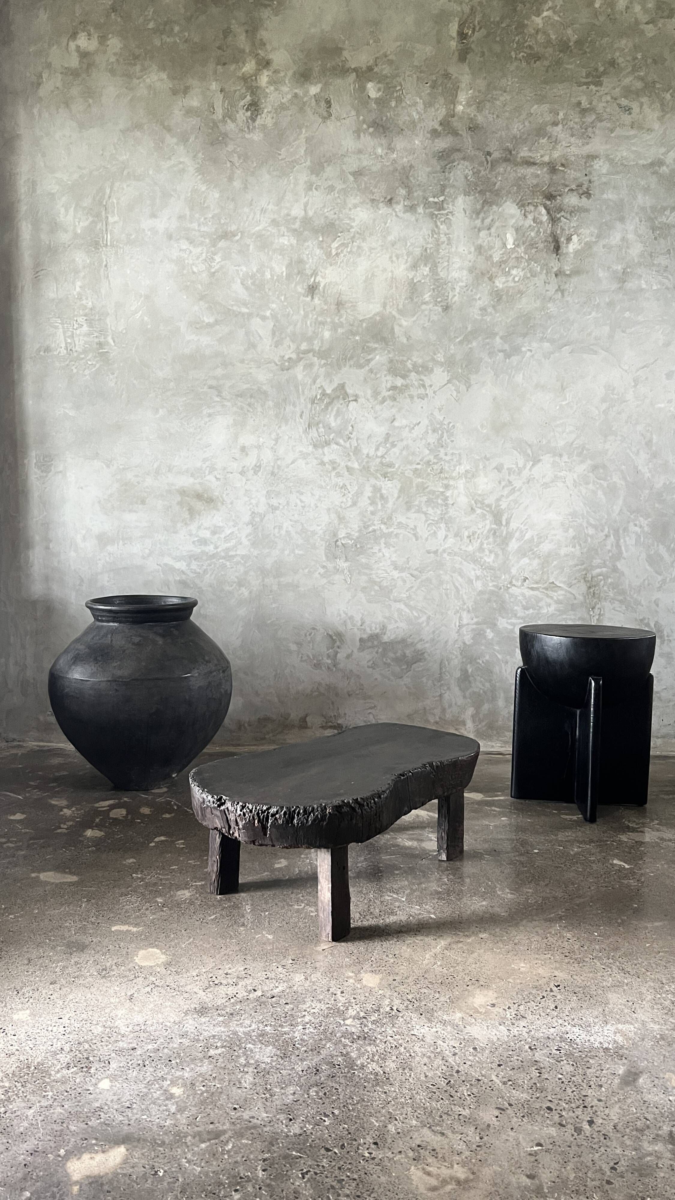 Small old Asian wooden coffee table in Japanese style, kidney-shaped top