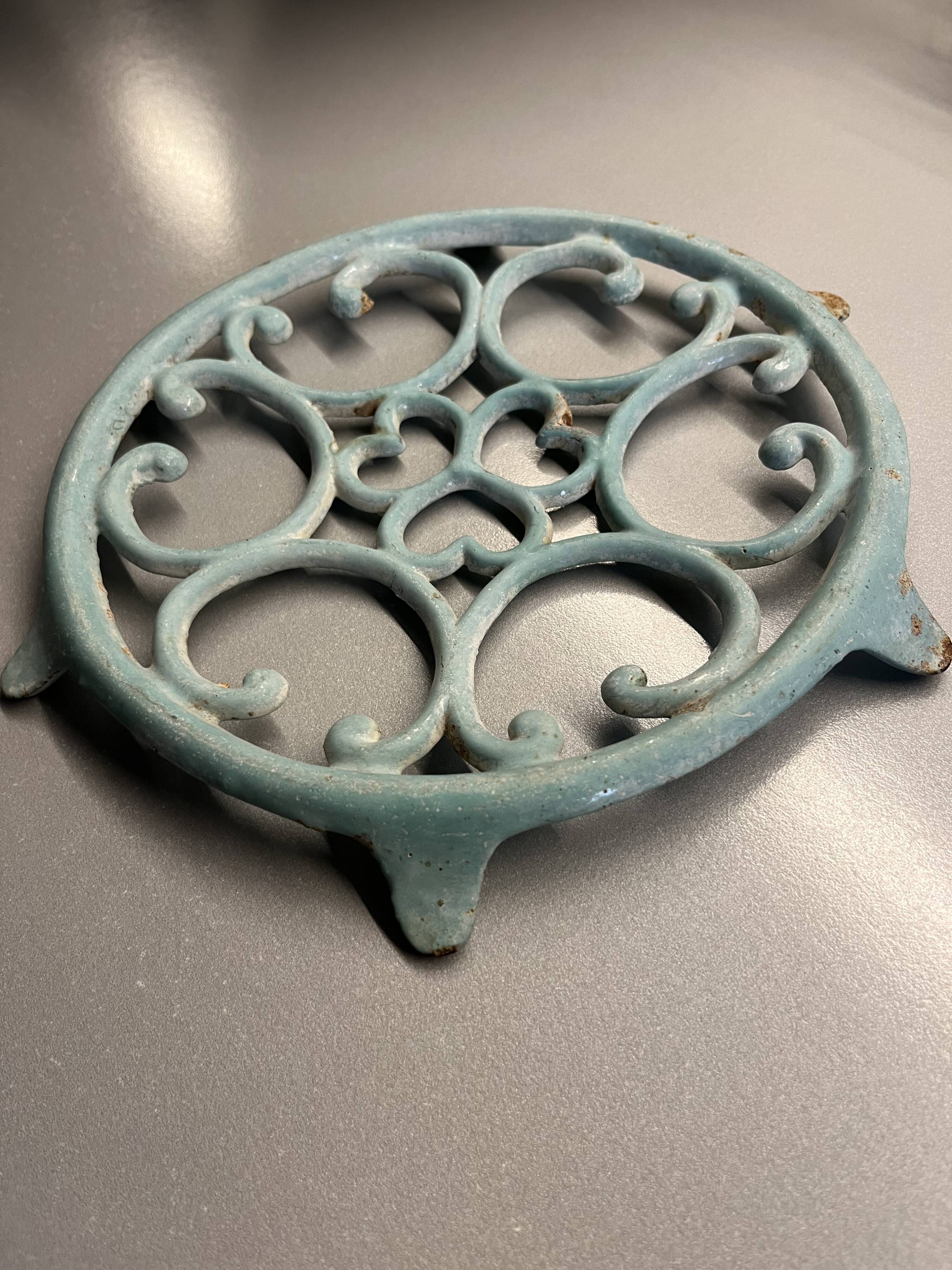 Old cast iron trivety turquoise