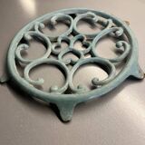 Old cast iron trivety turquoise