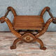 Bishop's curule armchair in solid walnut and gilding highlights with religious symbols