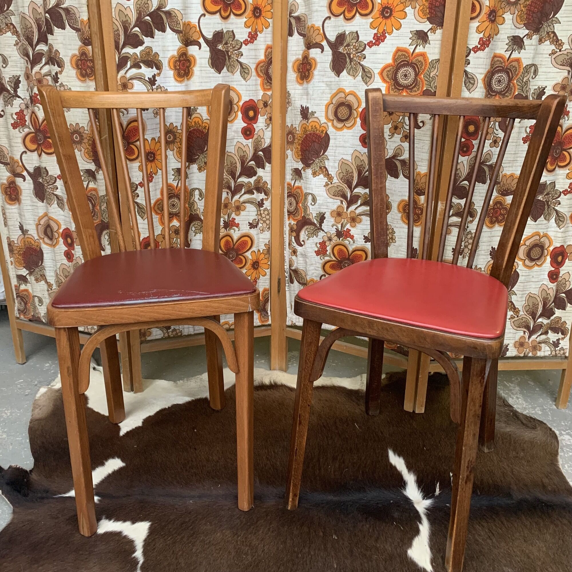 2 baumann bistro chairs sitting skai 1 red and 1 burgundy