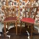2 baumann bistro chairs sitting skai 1 red and 1 burgundy