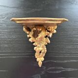Golden console in rococo style