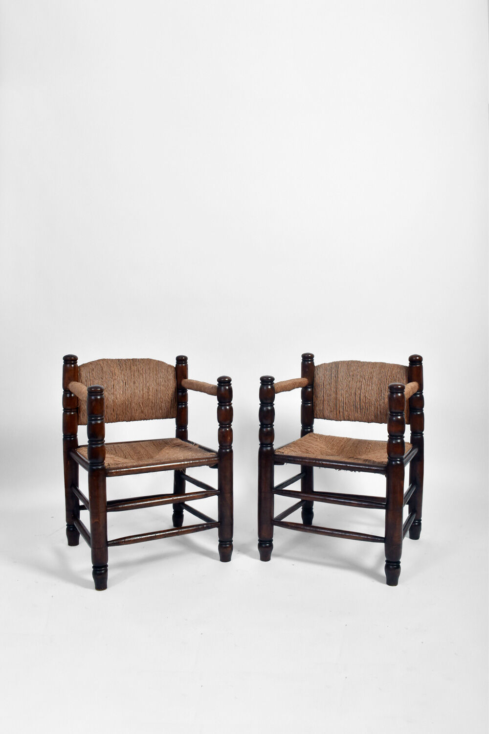 Pair of turned wood and straw armchairs, 1950s.