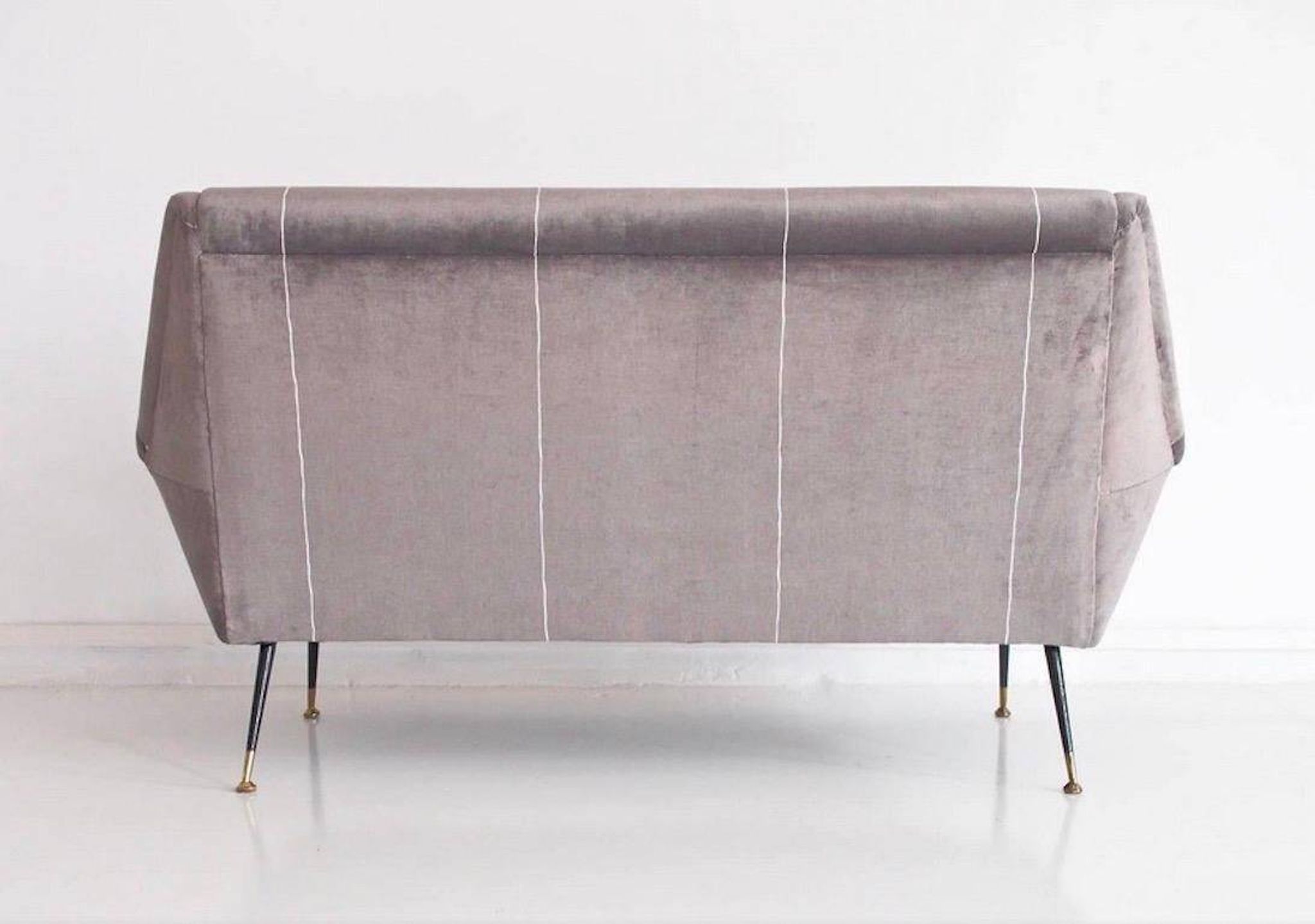 Italian velvet sofa in grey with black lacquered brass legs.