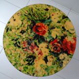 Round coffee table above resin flower decoration