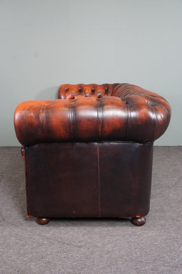 Chesterfield sofa in patinated orange leather, 2.5 seats